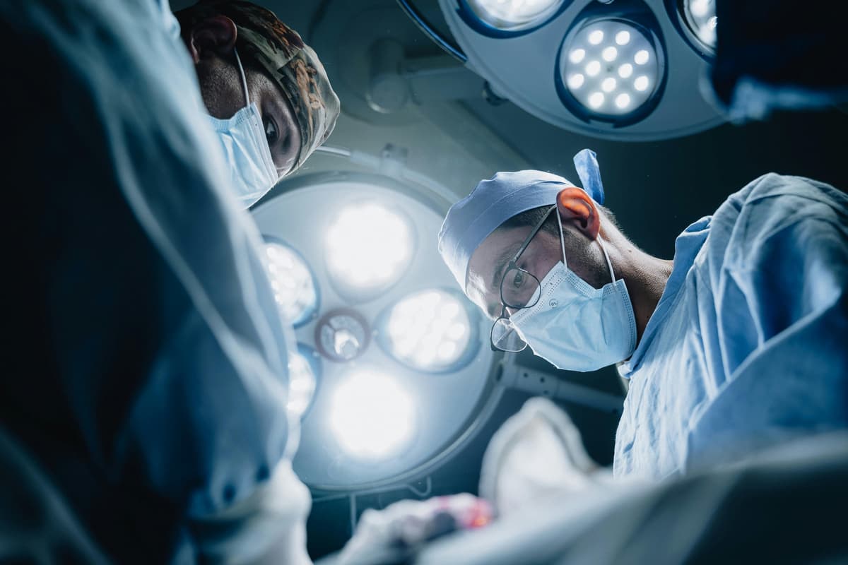 Specialist medical team working in a clinical procedure room